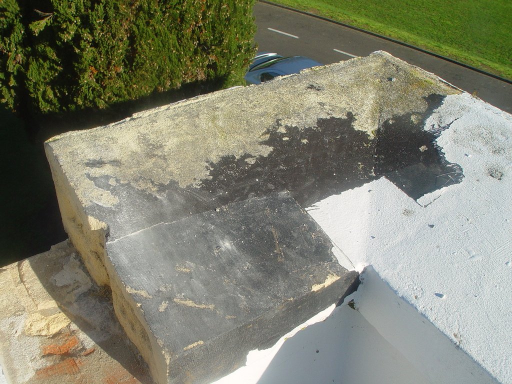 The cap/parapet on the building which is oamaru stone was tarred, fibreglassed and painted 20 years ago to stop moisture penetration.The cap had sealed all the moisture in the oamaru stone creating very bad effervescence on the walls and ceilings with water dripping on the inside. JetX stripped the fibreglass off by hand and then using our restoration techniques pulled the tar out of the stone without damage to the substrate.